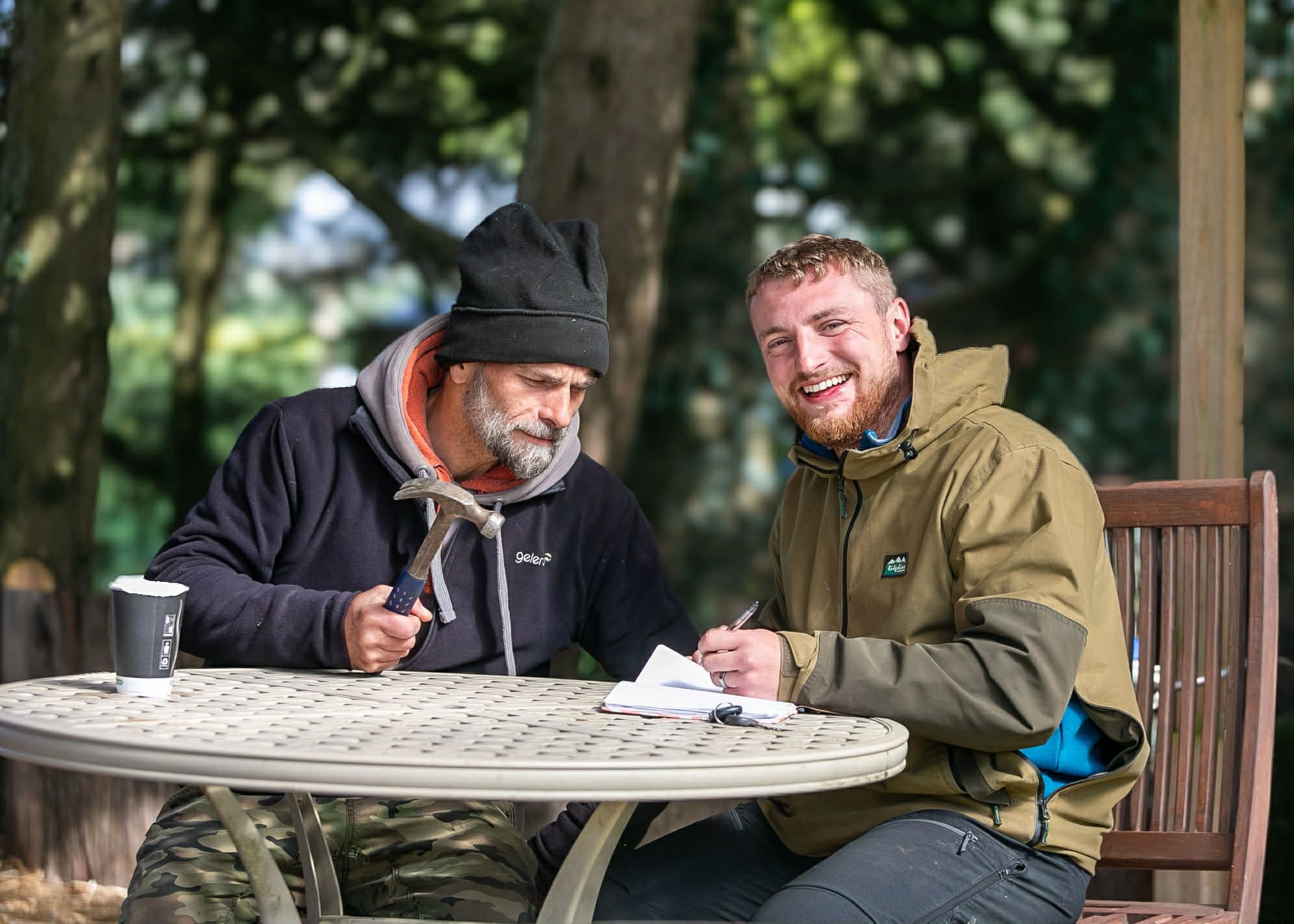 Harry and Maciej discussing plans for the farm